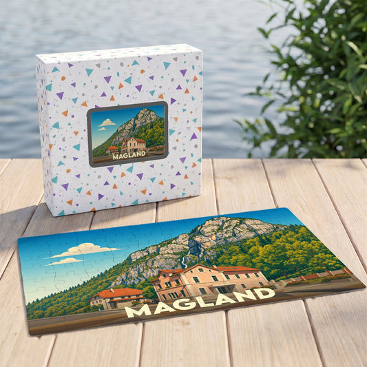 Puzzle souvenir de la ville de Magland représentant un paysage de montagne avec une illustration stylisée.