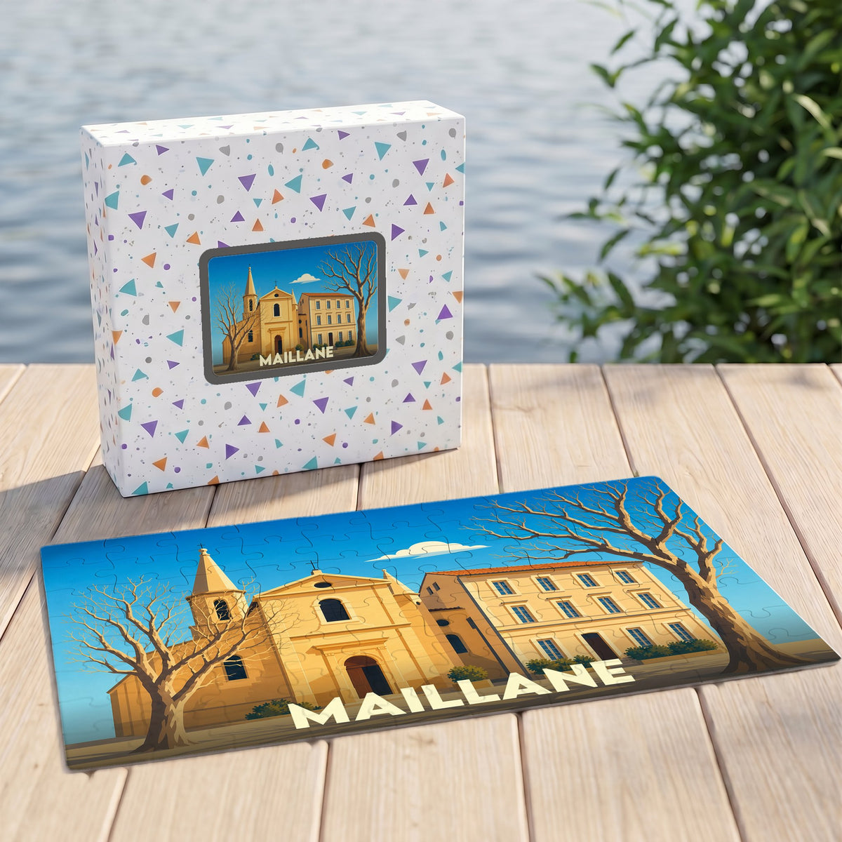 Puzzle souvenir de la ville de Maillane avec une illustration stylisée d'une église et de sa boîte assortie.