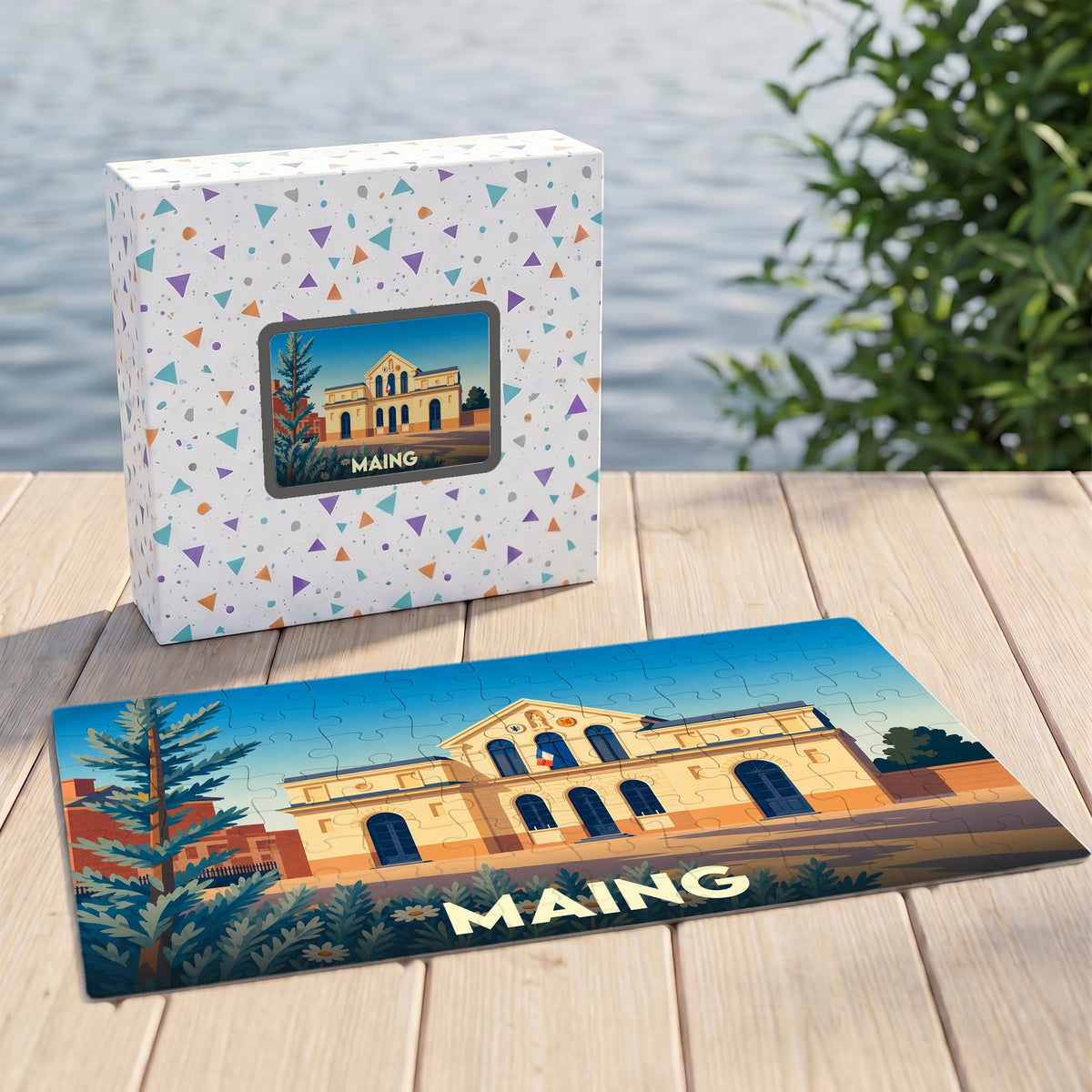 Puzzle souvenir de la ville de Maing avec une illustration stylisée de son hôtel de ville.