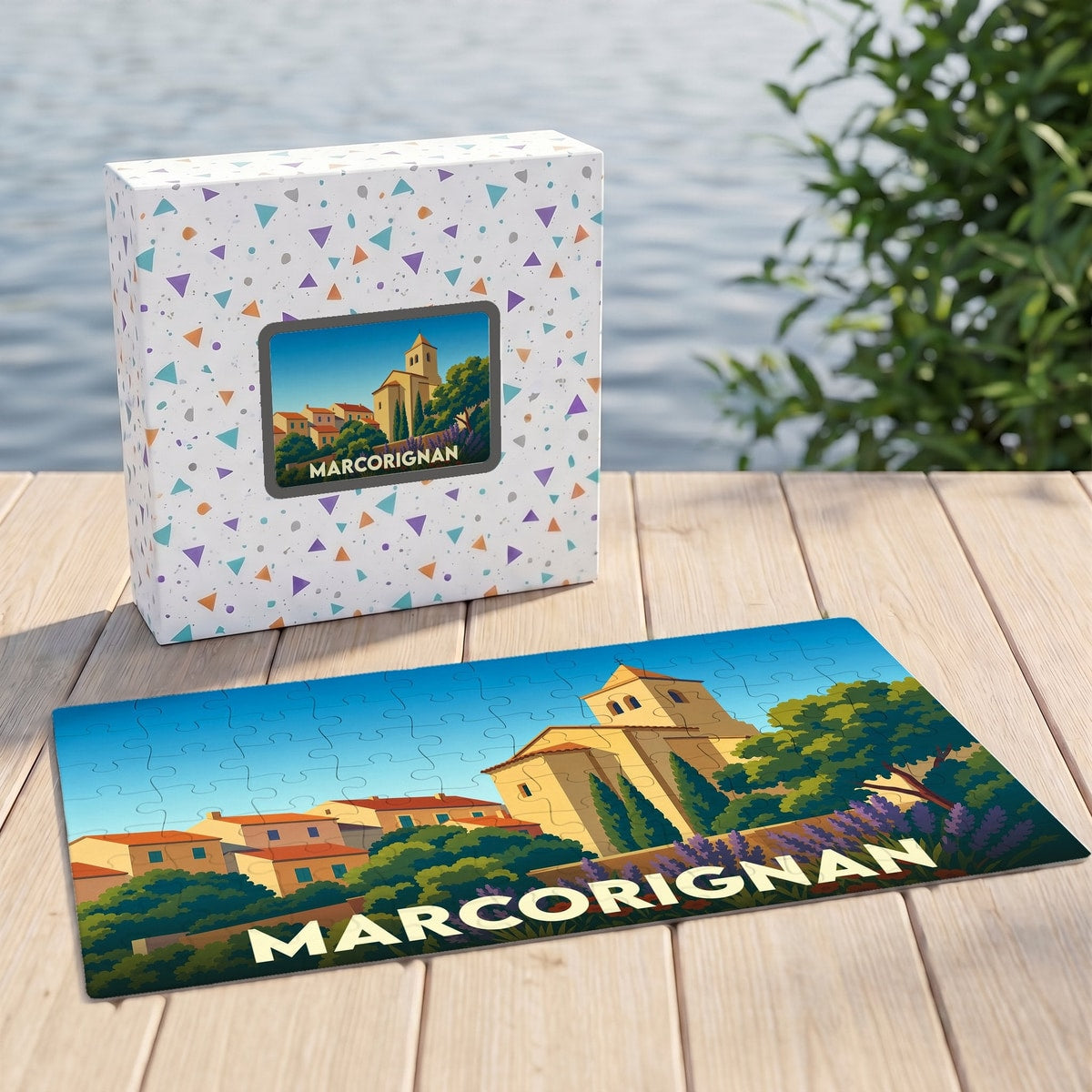 Puzzle souvenir de la ville de Marcorignan avec une illustration stylisée d'un paysage provençal.