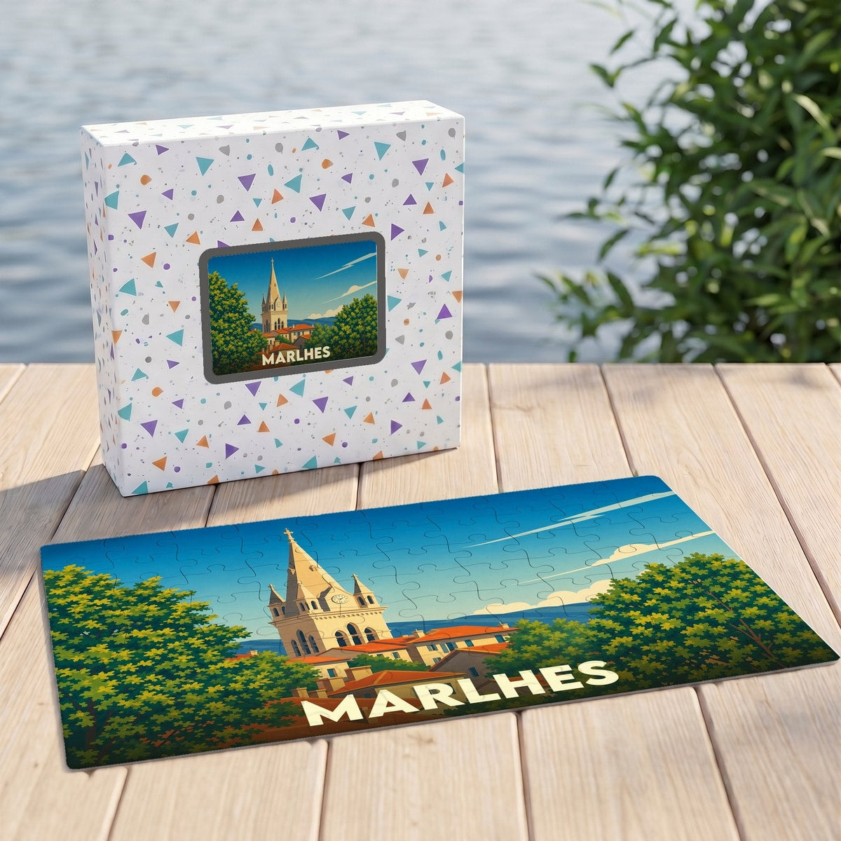 Puzzle souvenir de la ville de Marlhes avec une illustration stylisée du clocher et de son paysage.