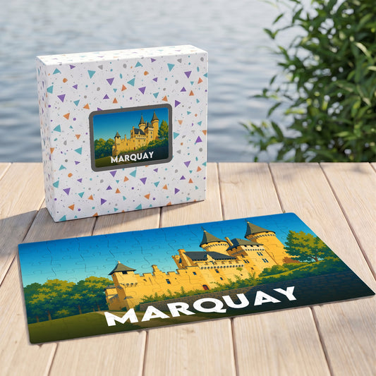 Puzzle souvenir de la ville de Marquay avec une illustration colorée de son château.
