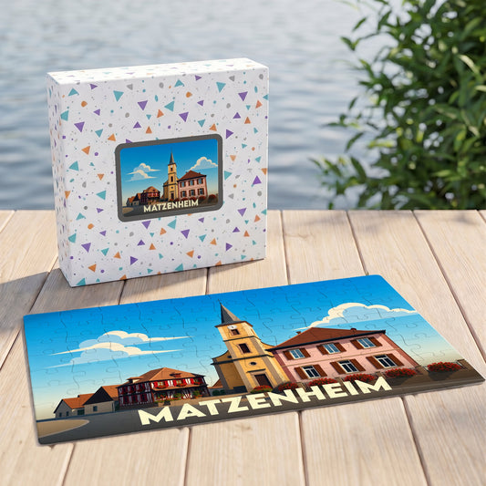 Puzzle souvenir de la ville de Matzenheim avec une illustration stylisée et sa boîte assortie.