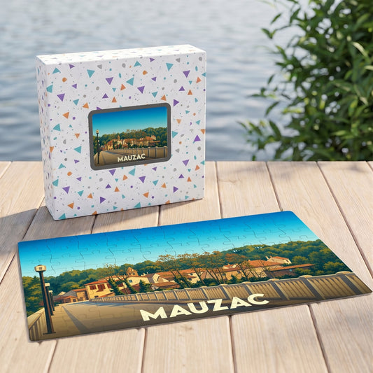 Puzzle souvenir de la ville de Mauzac avec une illustration stylisée et sa boîte assortie.
