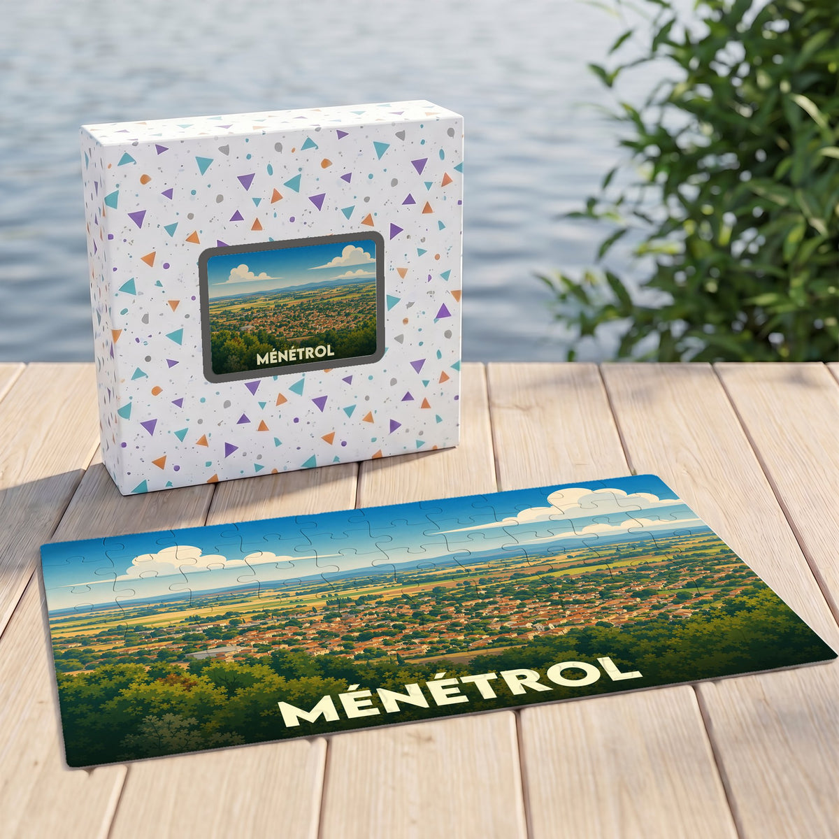 Puzzle souvenir de la ville de Ménétrol avec une illustration stylisée de son paysage urbain.