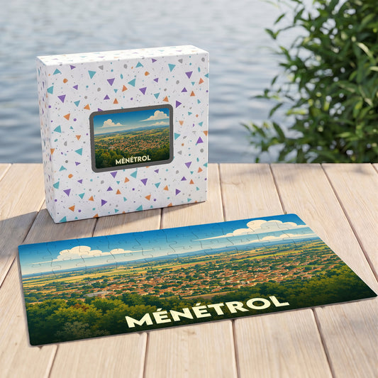 Puzzle souvenir de la ville de Ménétrol avec une illustration stylisée de son paysage urbain.