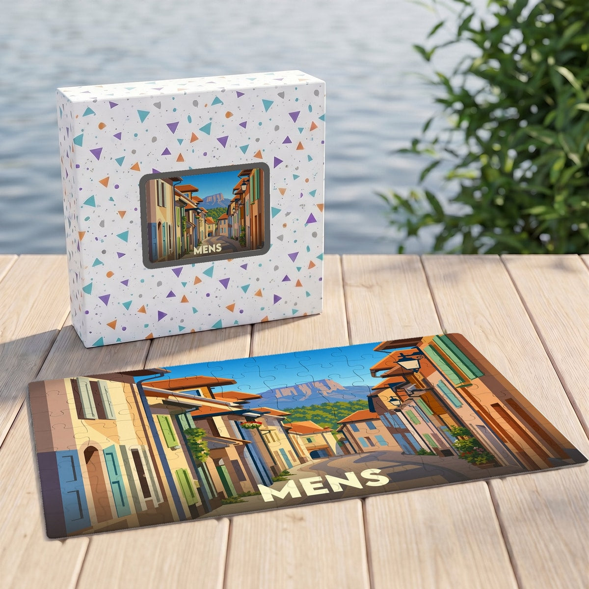 Puzzle souvenir de la ville de Mens avec une illustration stylisée d'une rue pittoresque.