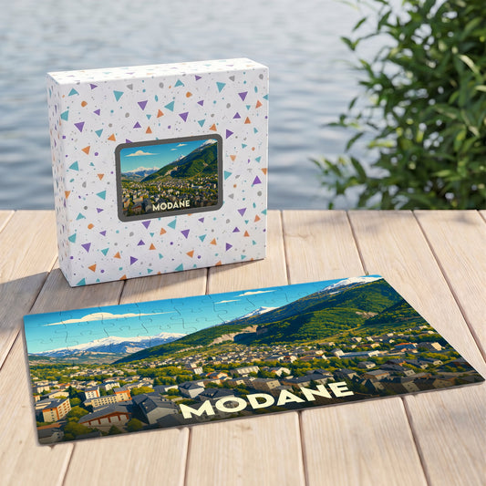 Puzzle souvenir de la ville de Modane avec une illustration stylisée de ses montagnes et habitations.