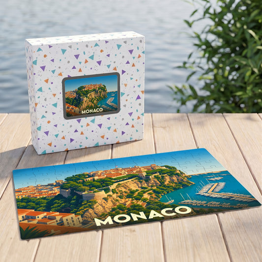 Puzzle souvenir de la ville de Monaco avec une illustration stylisée de son rocher et de son port.