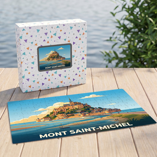 Puzzle souvenir du Mont Saint-Michel avec une illustration stylisée de l'abbaye sur sa boîte et son plateau.