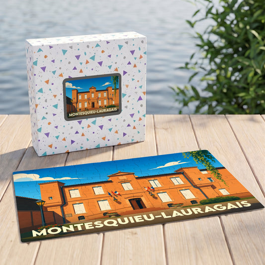 Puzzle souvenir de la ville de Montesquieu-Lauragais avec une illustration stylisée et sa boîte assortie.