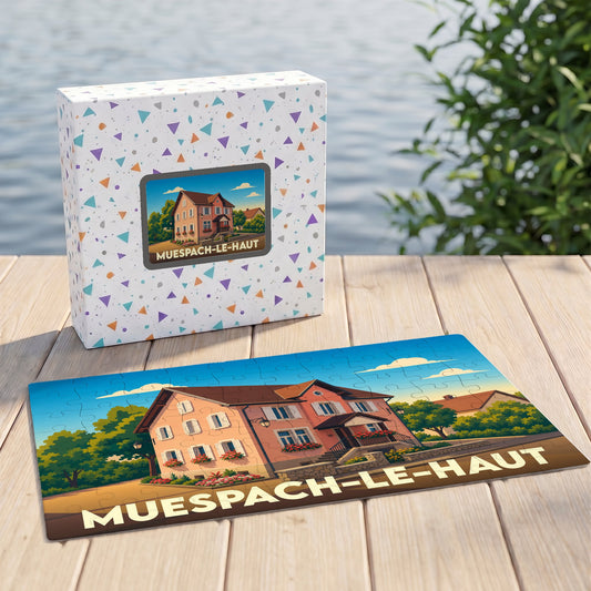 Puzzle souvenir de la ville de Muespach-le-Haut avec une illustration stylisée d'une maison alsacienne.