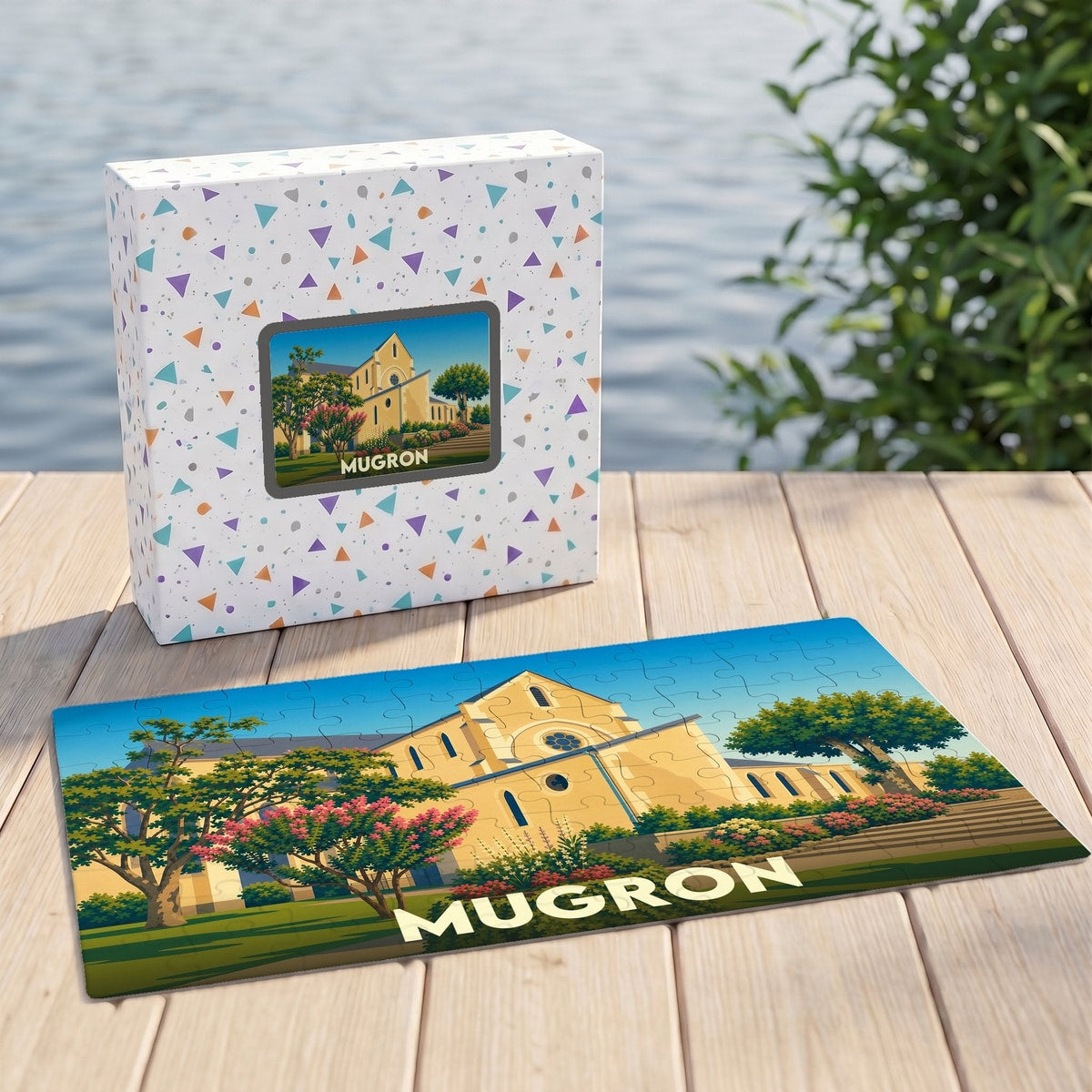 Puzzle souvenir de la ville de Mugron avec une illustration stylisée de son église et de ses jardins.