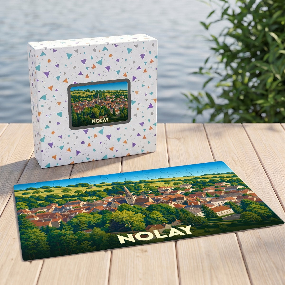 Puzzle souvenir de la ville de Nolay avec une illustration paysagère colorée.