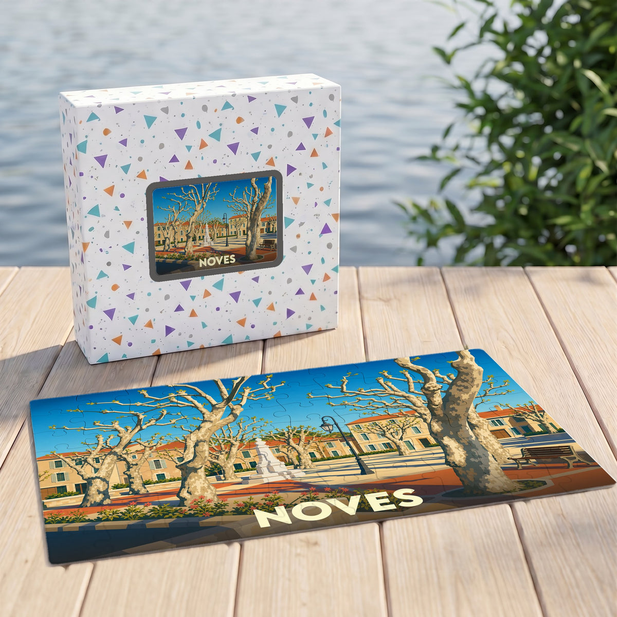 Puzzle souvenir de la ville de Noves avec une illustration stylisée d'une place arborée.