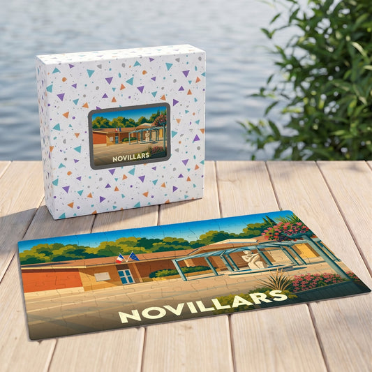 Puzzle souvenir de la ville de Novillars avec une illustration stylisée et sa boîte assortie.