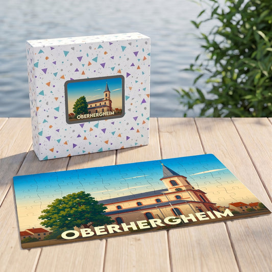 Puzzle souvenir de la ville de Oberhergheim avec une illustration stylisée d'une église sous un ciel azur.
