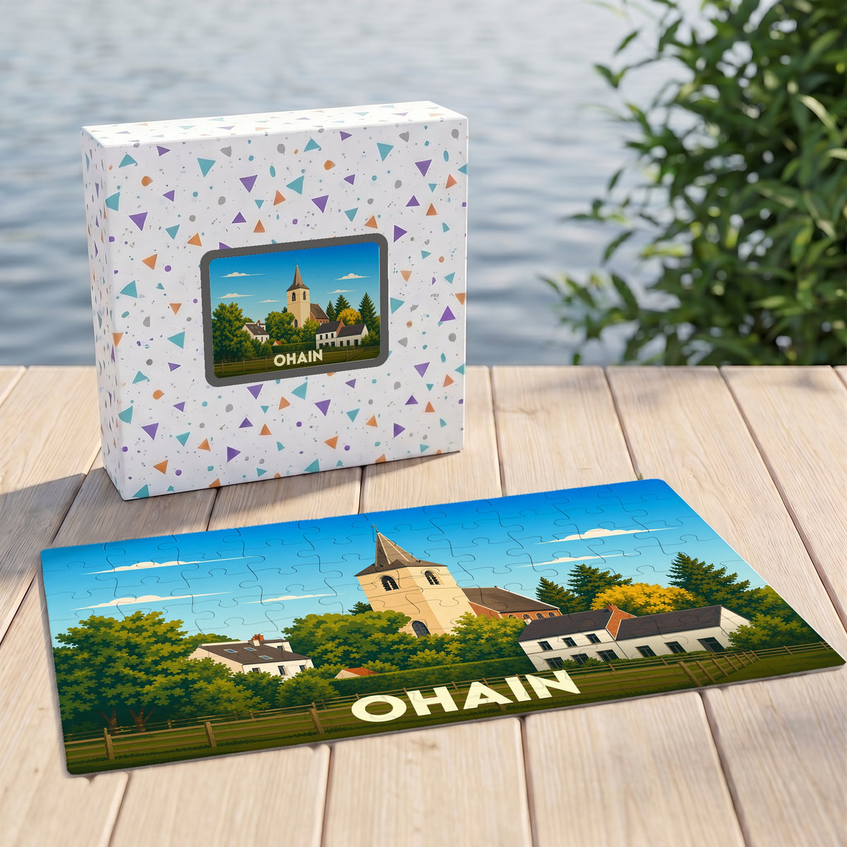 Puzzle souvenir de la ville de Ohain avec une illustration stylisée d'un paysage de village et son église.