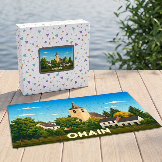 Puzzle souvenir de la ville de Ohain avec une illustration stylisée d'un paysage de village et son église.