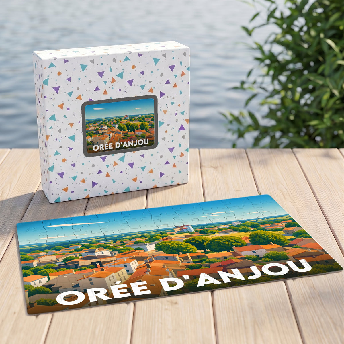 Puzzle souvenir de la ville d'Orée d'Anjou avec une illustration paysagère stylisée.