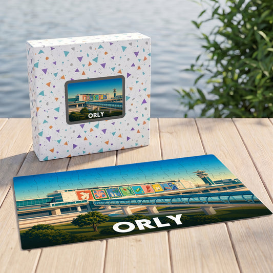 Puzzle souvenir de la ville d'Orly illustrant son aéroport avec un style graphique coloré.