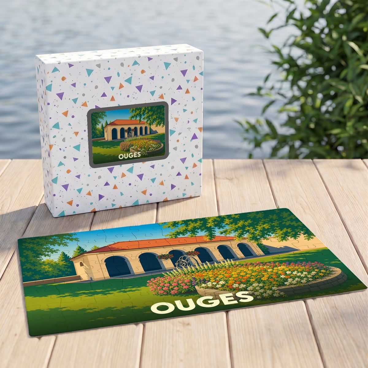 Puzzle souvenir de la ville de Ouges avec une illustration stylisée d'un bâtiment à arcades et de jardins fleuris.