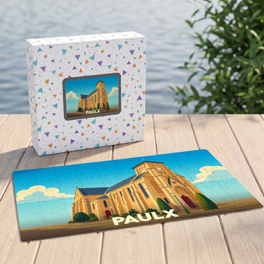 Puzzle souvenir de la ville de Paulx avec une illustration stylisée de son église.