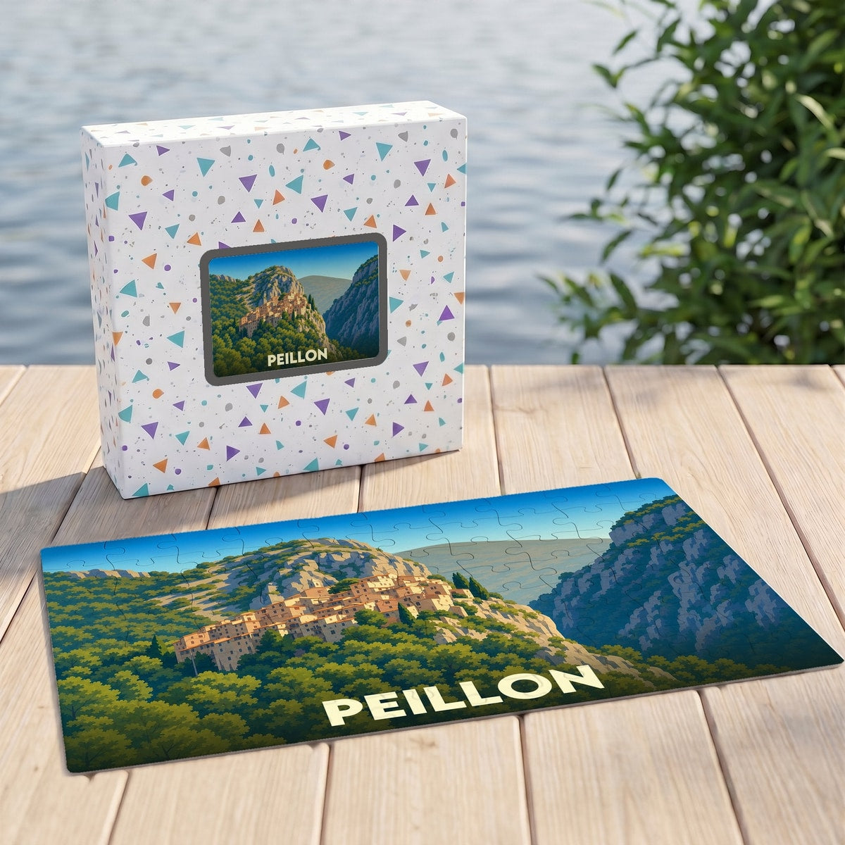 Puzzle souvenir de la ville de Peillon avec une illustration stylisée d'un village perché.