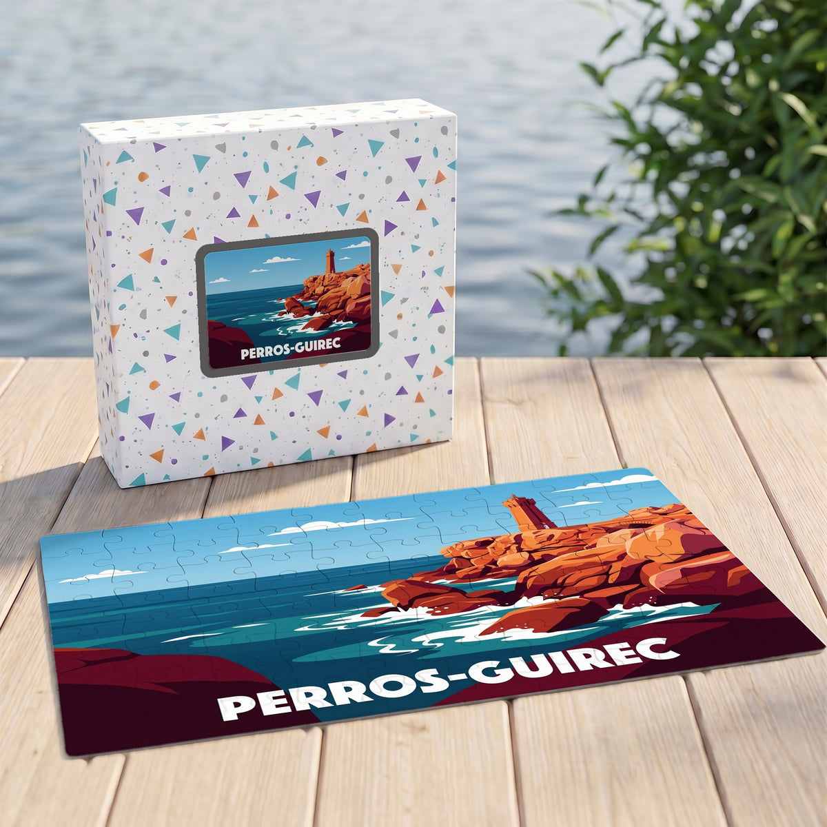 Puzzle souvenir de la ville de Perros-Guirec avec son coffret, illustrant le phare de Men Ruz de manière stylisée.