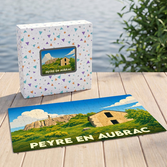 Puzzle souvenir de la commune de Peyre en Aubrac avec une illustration stylisée.
