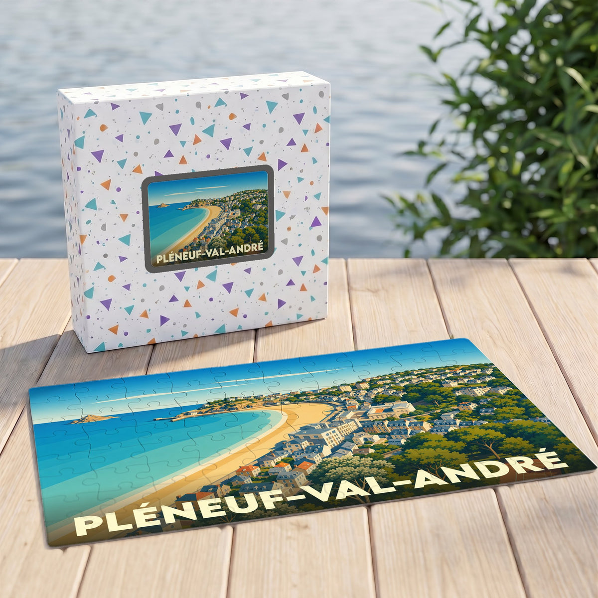 Puzzle souvenir de la ville de Pléneuf-Val-André avec son coffret et une illustration stylisée de la côte.