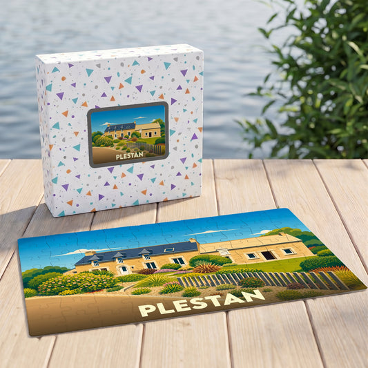 Puzzle souvenir de la ville de Plestan avec une illustration stylisée d'une maison traditionnelle.