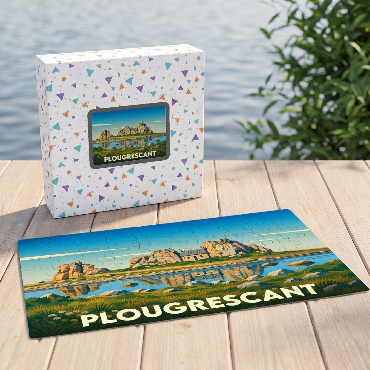 Puzzle souvenir de la ville de Plougrescant avec une illustration stylisée d'une maison entre deux rochers.
