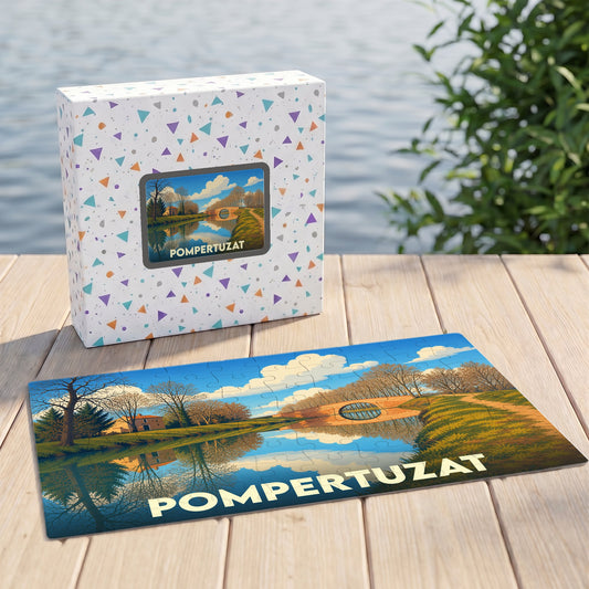Puzzle souvenir de la ville de Pompertuzat avec une illustration stylisée d'un canal et de son pont.