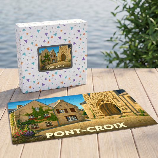Puzzle souvenir de la ville de Pont-Croix avec une illustration stylisée d'une église et de maisons anciennes.
