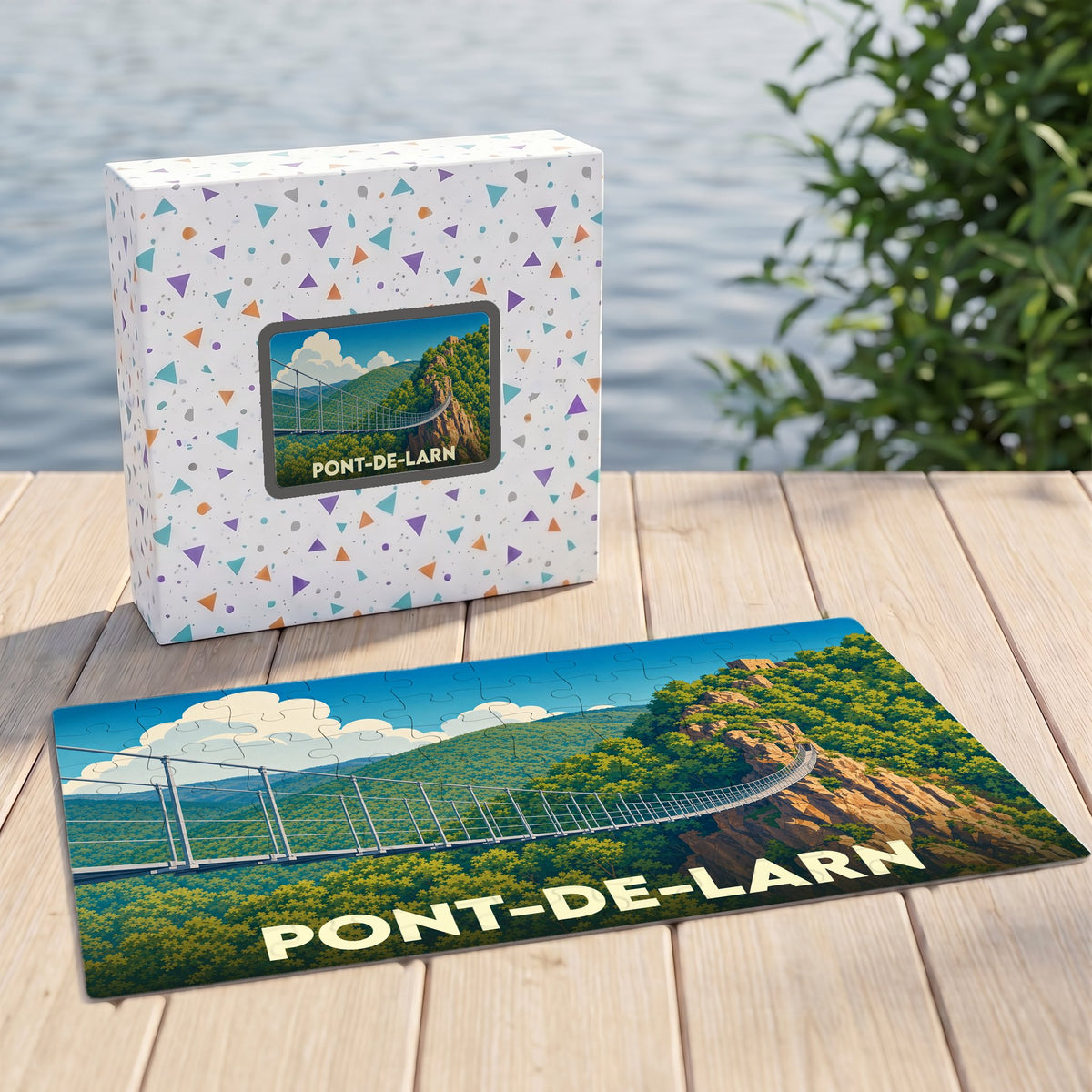 Puzzle souvenir de la ville de Pont-de-Larn avec une illustration stylisée d'une passerelle suspendue.