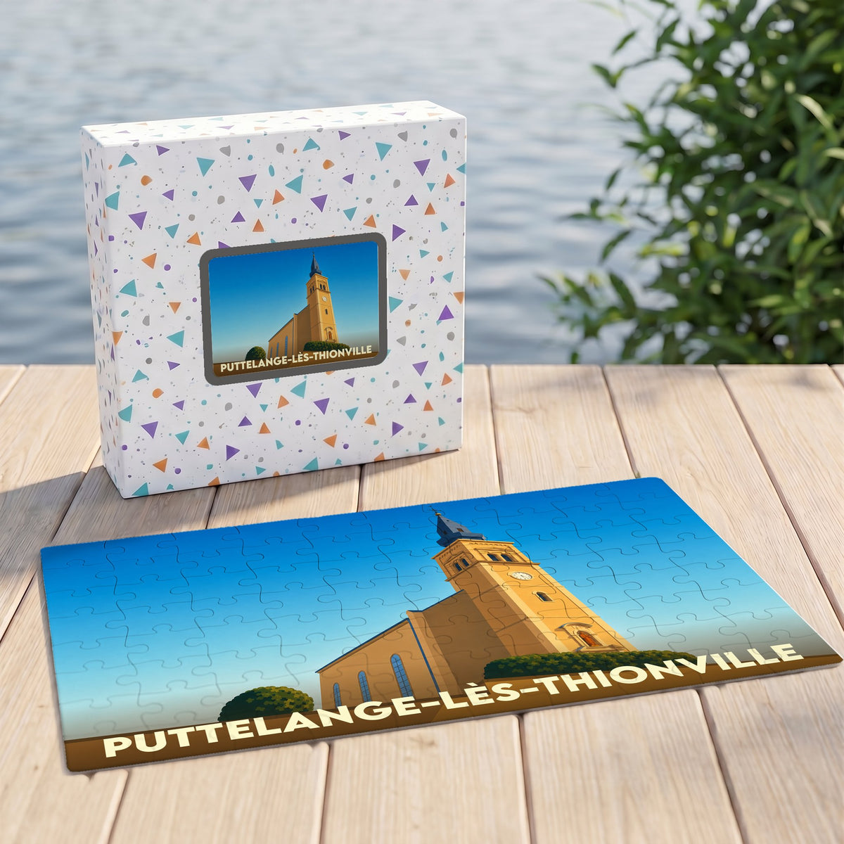 Puzzle souvenir de la ville de Puttelange-lès-Thionville avec une illustration stylisée de son église.