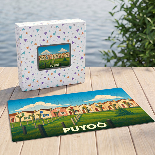 Puzzle souvenir de la ville de Puyoô illustrant une rangée de maisons colorées dans un style graphique épuré.