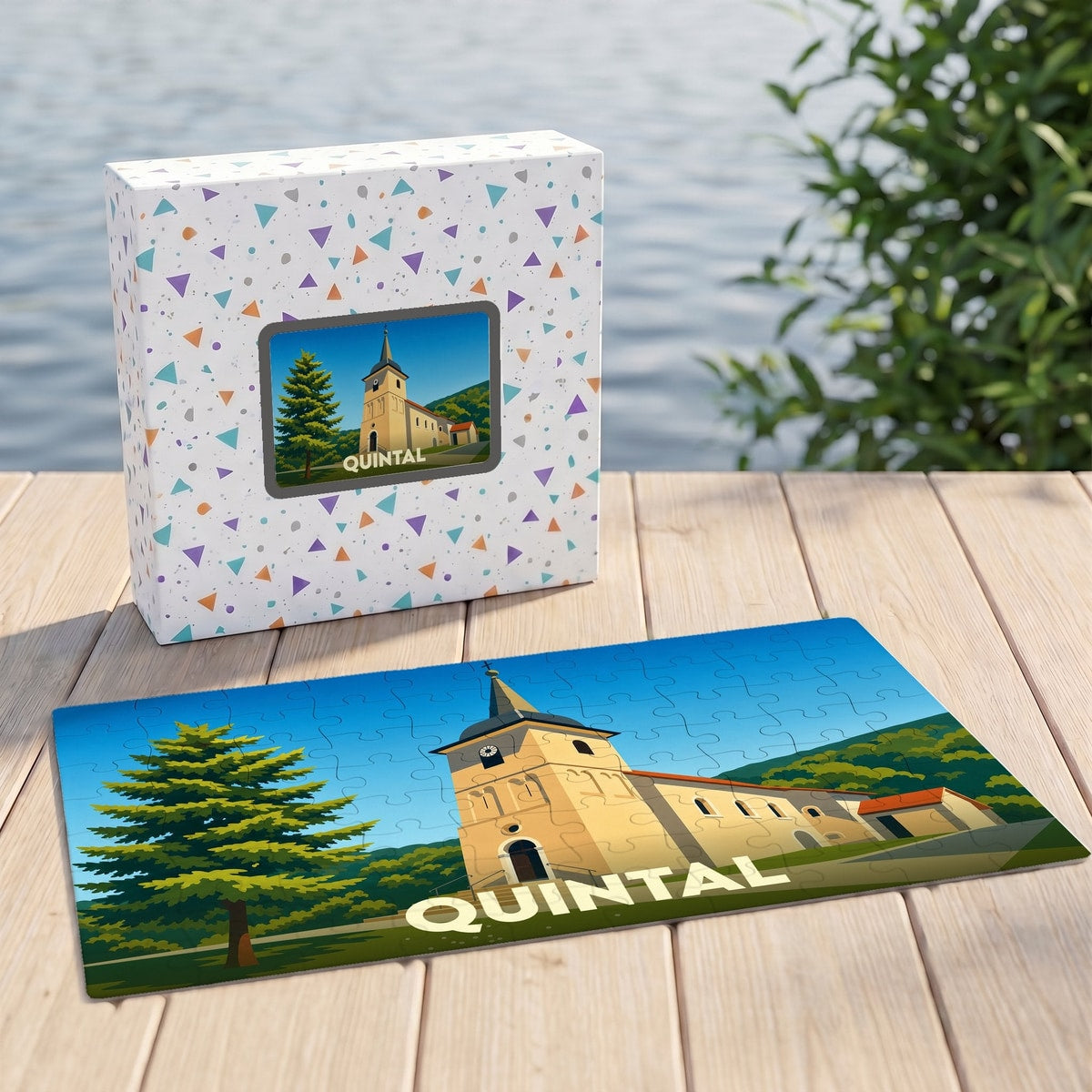 Puzzle souvenir de la ville de Quintal avec une illustration stylisée de son église et de son paysage.