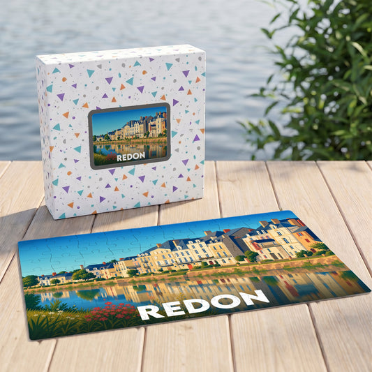 Puzzle souvenir de la ville de Redon illustrant ses quais et leurs reflets sur l'eau.