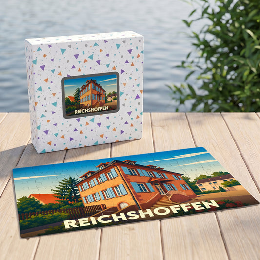 Puzzle souvenir de la ville de Reichshoffen avec une illustration colorée d'un bâtiment historique.