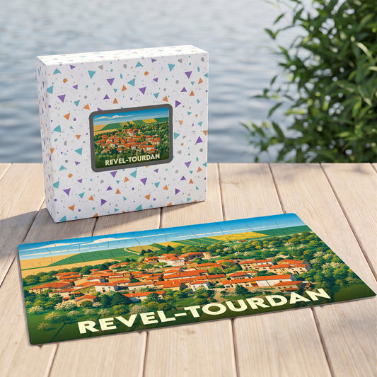 Puzzle souvenir de la ville de Revel-Tourdan avec une illustration colorée de ses paysages et toitures.