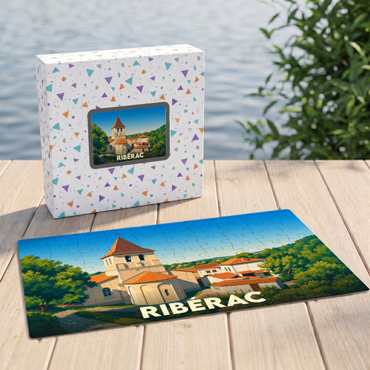 Puzzle souvenir de la ville de Ribérac illustré par un dessin stylisé de son église et de ses environs.