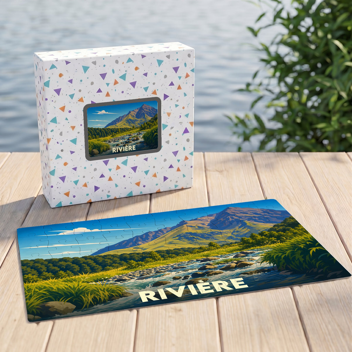 Puzzle souvenir de la ville de Rivière avec une illustration stylisée de paysage montagneux.
