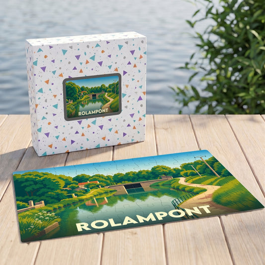 Puzzle souvenir de la ville de Rolampont avec une illustration stylisée d'un canal et son coffret assorti.