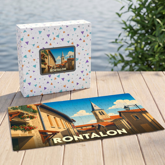 Puzzle souvenir de la commune de Rontalon avec une illustration stylisée d'une rue du village et son clocher.