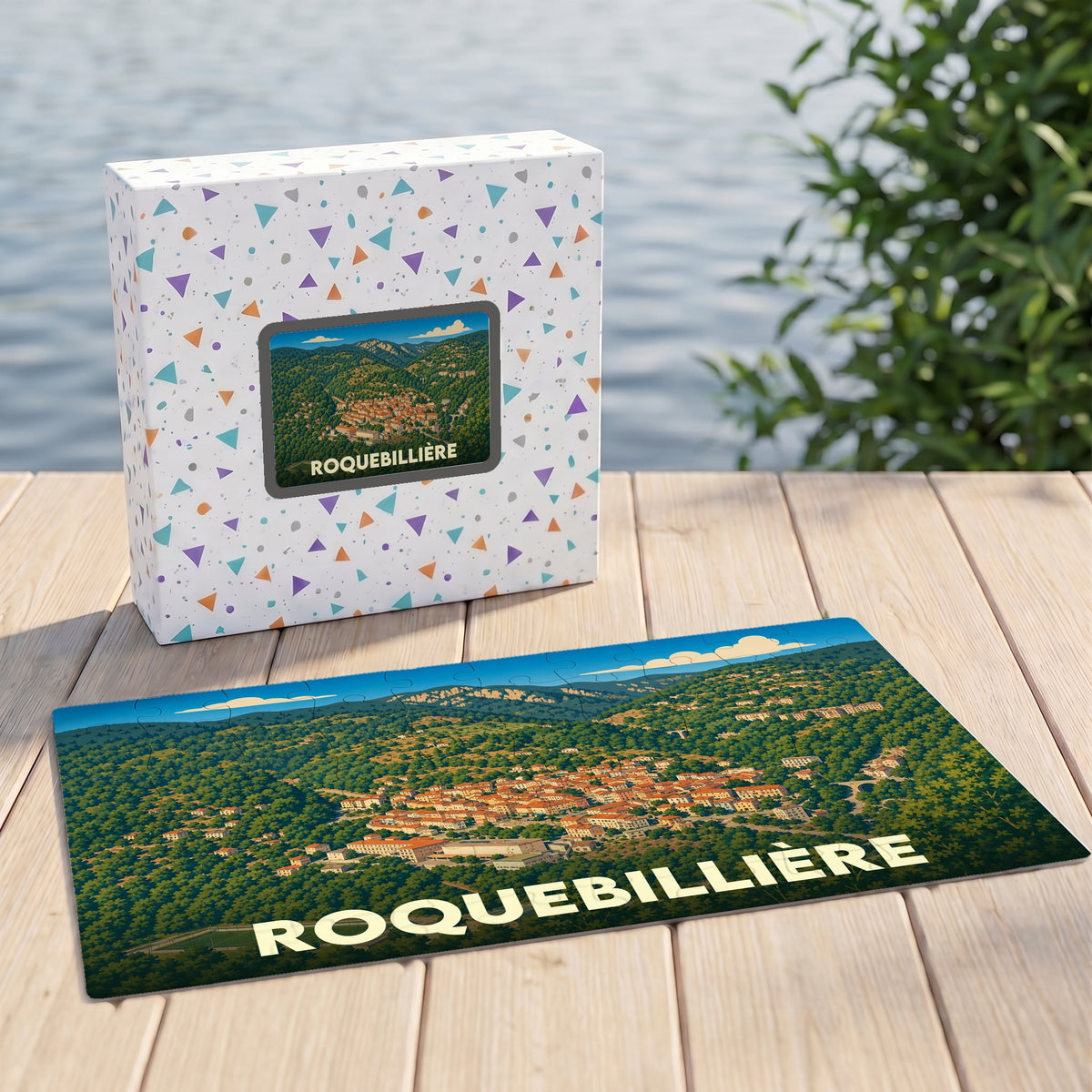 Puzzle souvenir de la ville de Roquebillière avec une illustration panoramique stylisée.