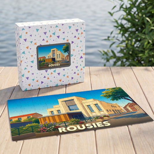 Puzzle souvenir de la ville de Rousies avec une illustration stylisée de ses bâtiments.