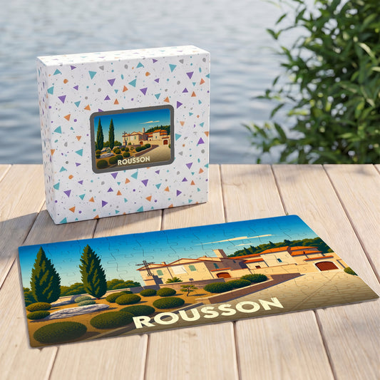 Puzzle souvenir de la ville de Rousson avec une illustration stylisée de son paysage urbain.