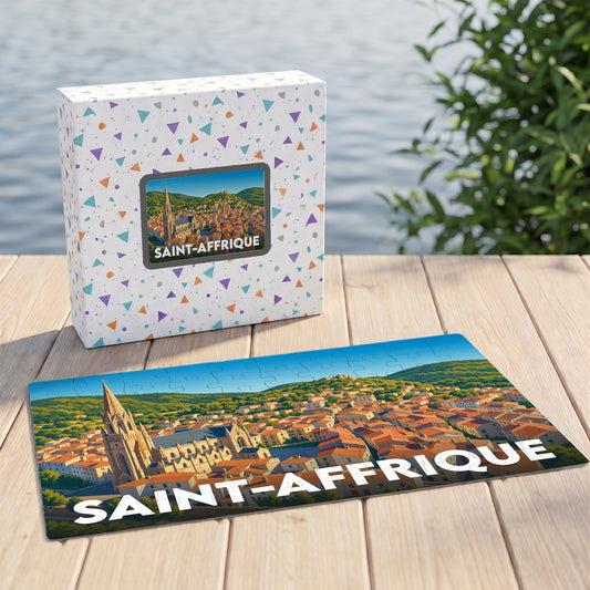 Puzzle souvenir de la ville de Saint-Affrique avec une illustration stylisée d'un panorama urbain.